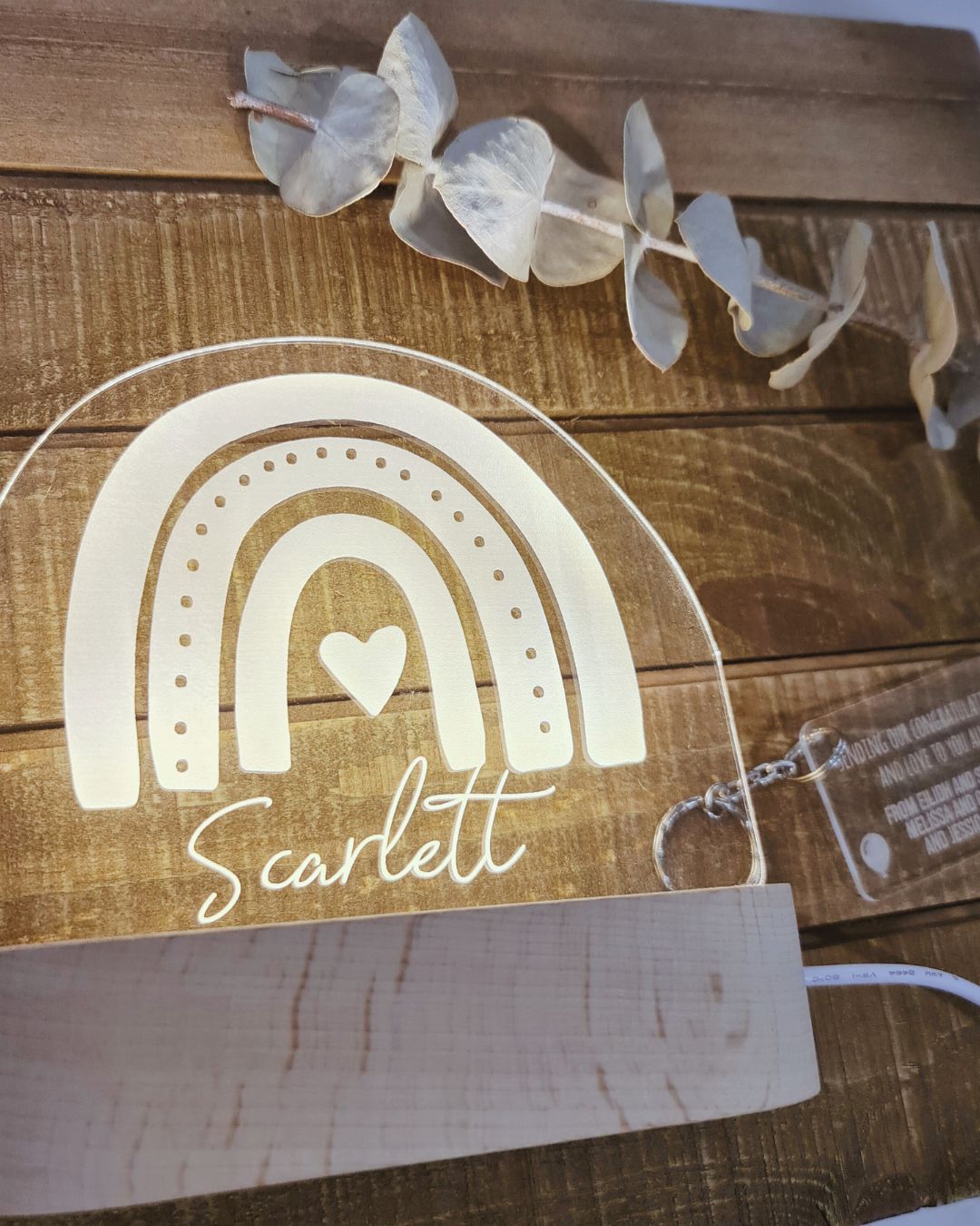 A beautifully crafted Warm White Night Light from The Willow Corner in the Triple Rainbow design, featuring three arches and a heart in the center. The name 